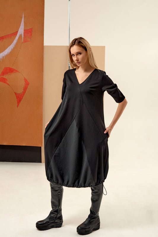Dress unique silhouette with a subtle v-neckline