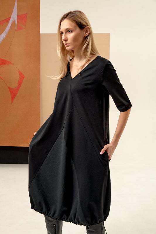 Dress unique silhouette with a subtle v-neckline