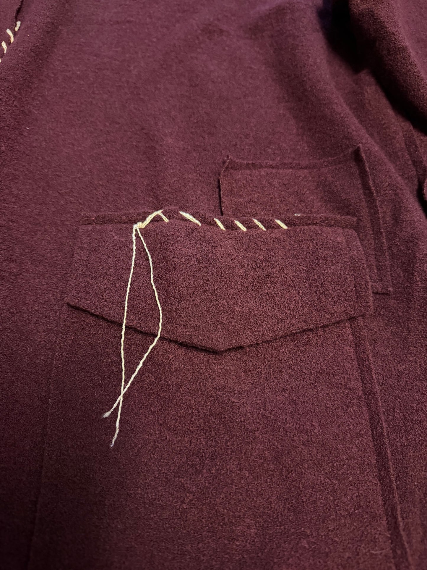 Square top with hand stitching