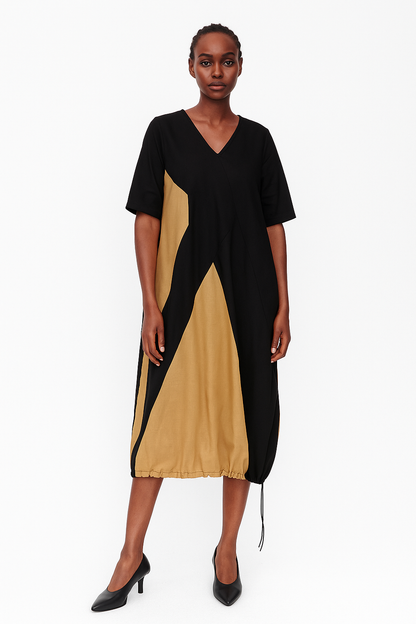 Dress unique silhouette with a subtle v-neckline