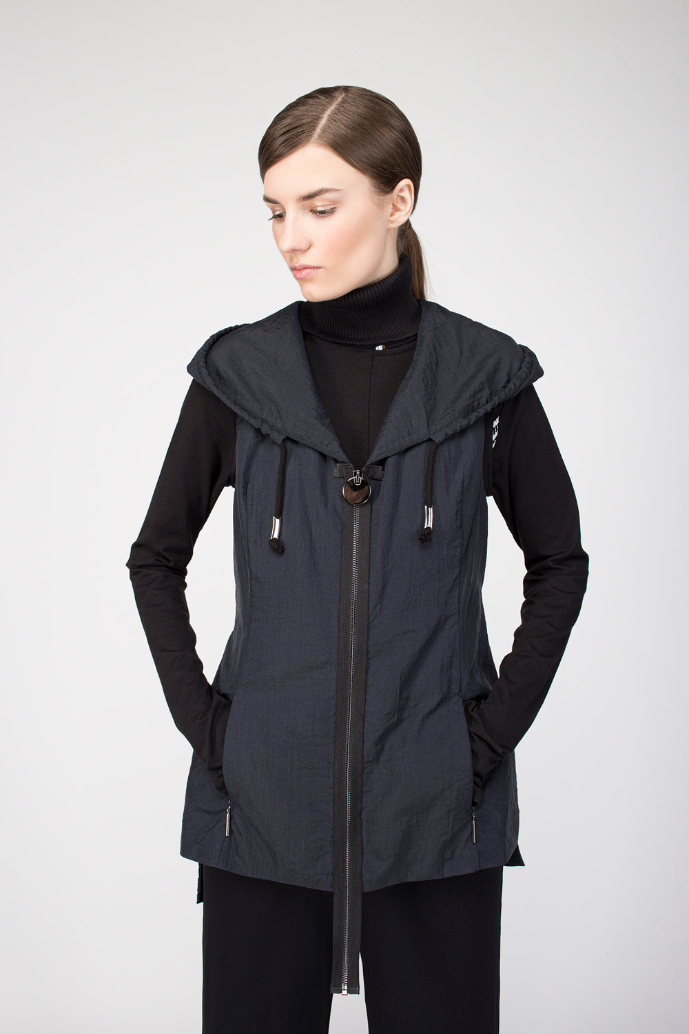 Vest with hood and zipper closure