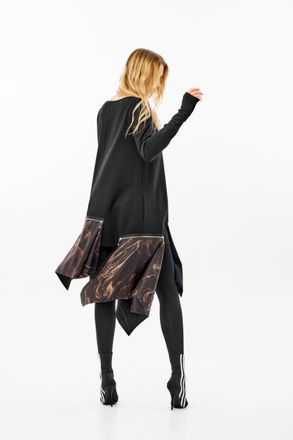 Long sleeve dress featuring a striking asymmetrical hemline