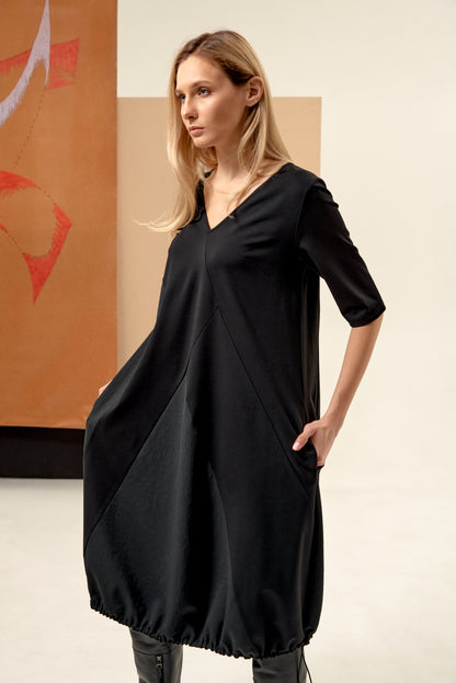Dress unique silhouette with a subtle v-neckline