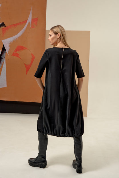 Dress unique silhouette with a subtle v-neckline