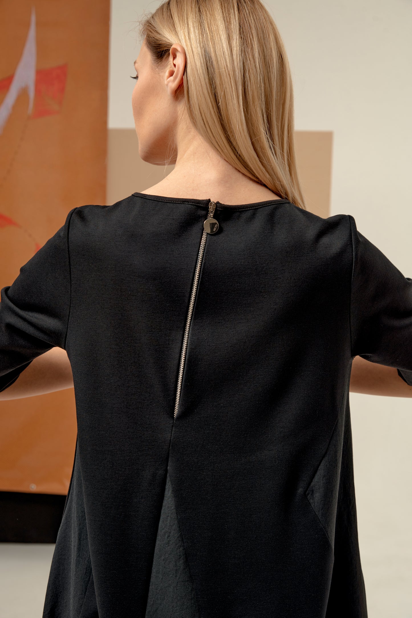 Dress unique silhouette with a subtle v-neckline