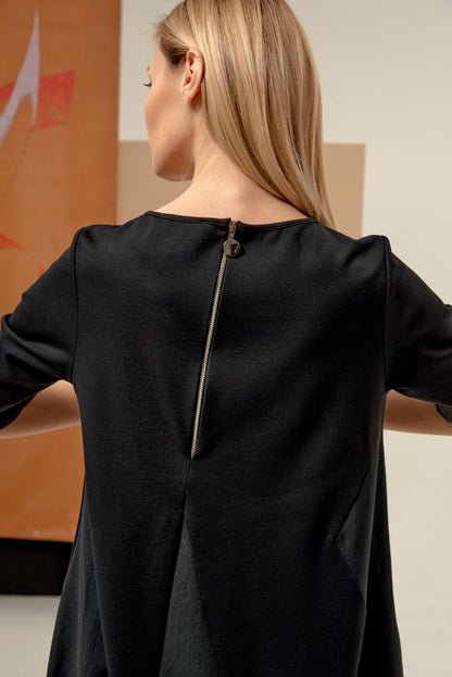 Dress unique silhouette with a subtle v-neckline