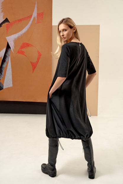 Dress unique silhouette with a subtle v-neckline