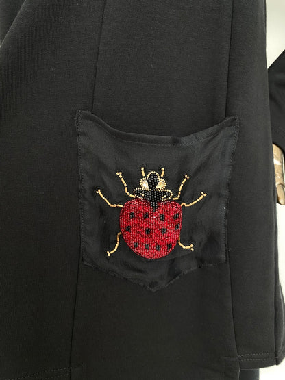 Sweatshirt top with hand beaded bug details