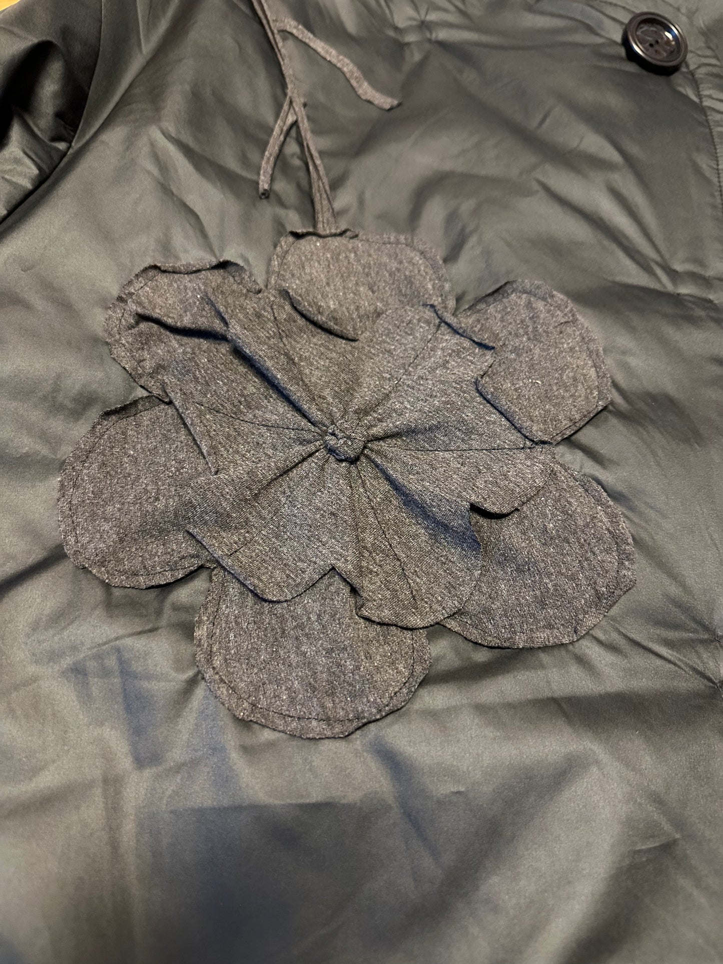 Jacket asymmetrical with hand sewing details