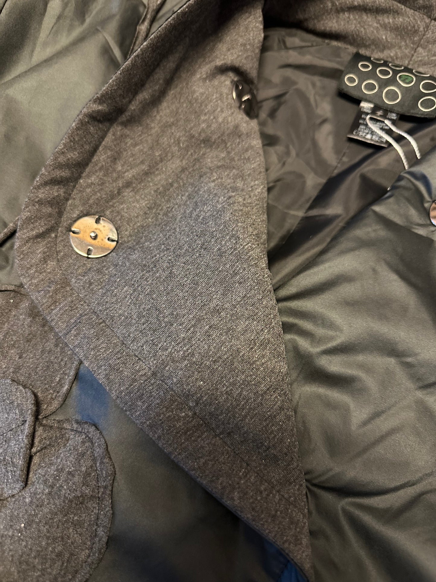 Jacket asymmetrical with hand sewing details