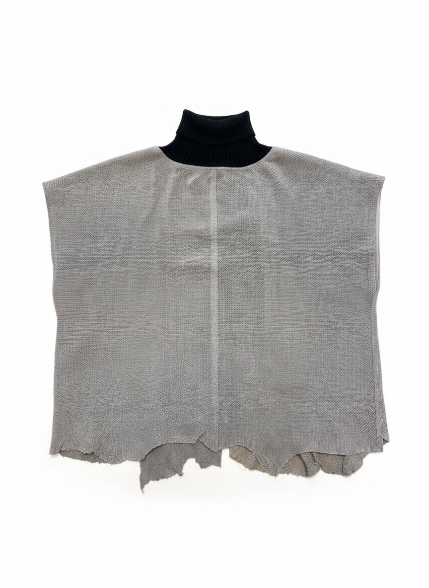 Gray textured leather piece on a wooden floor